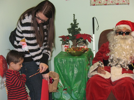 A mother and son coming to see Blind Santa